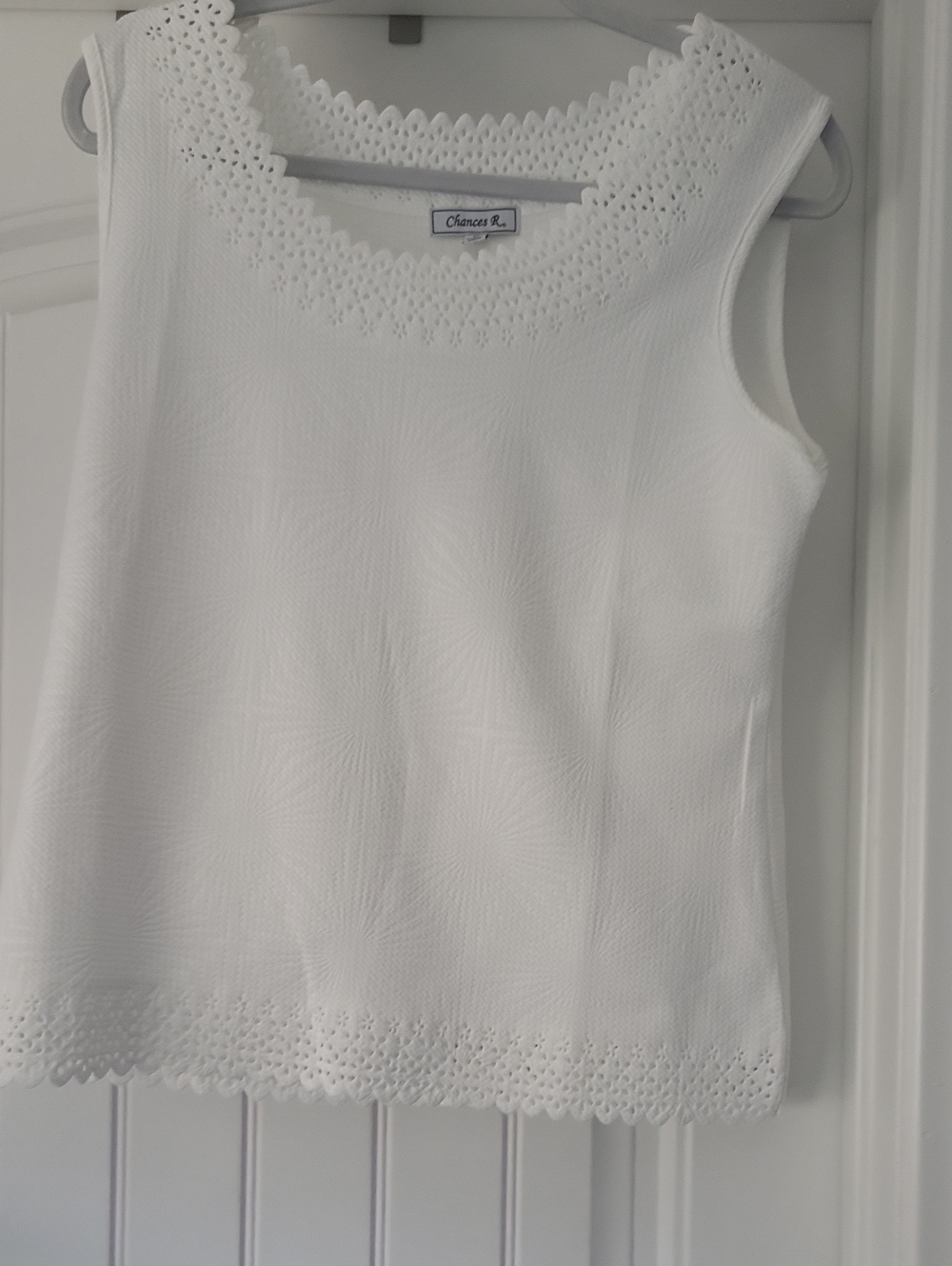 Chance's White Sleeveless Eyelet Trim Knit Top
